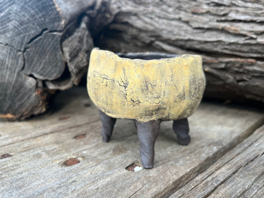 Black pot with ochre slip